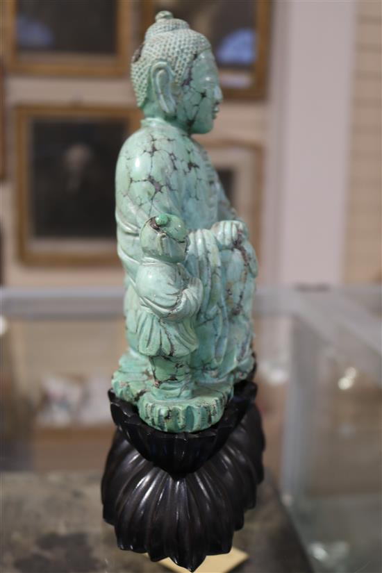 A Chinese turquoise matrix group of a buddha and attendants, circa 1900, 6.75in. 9in. overall